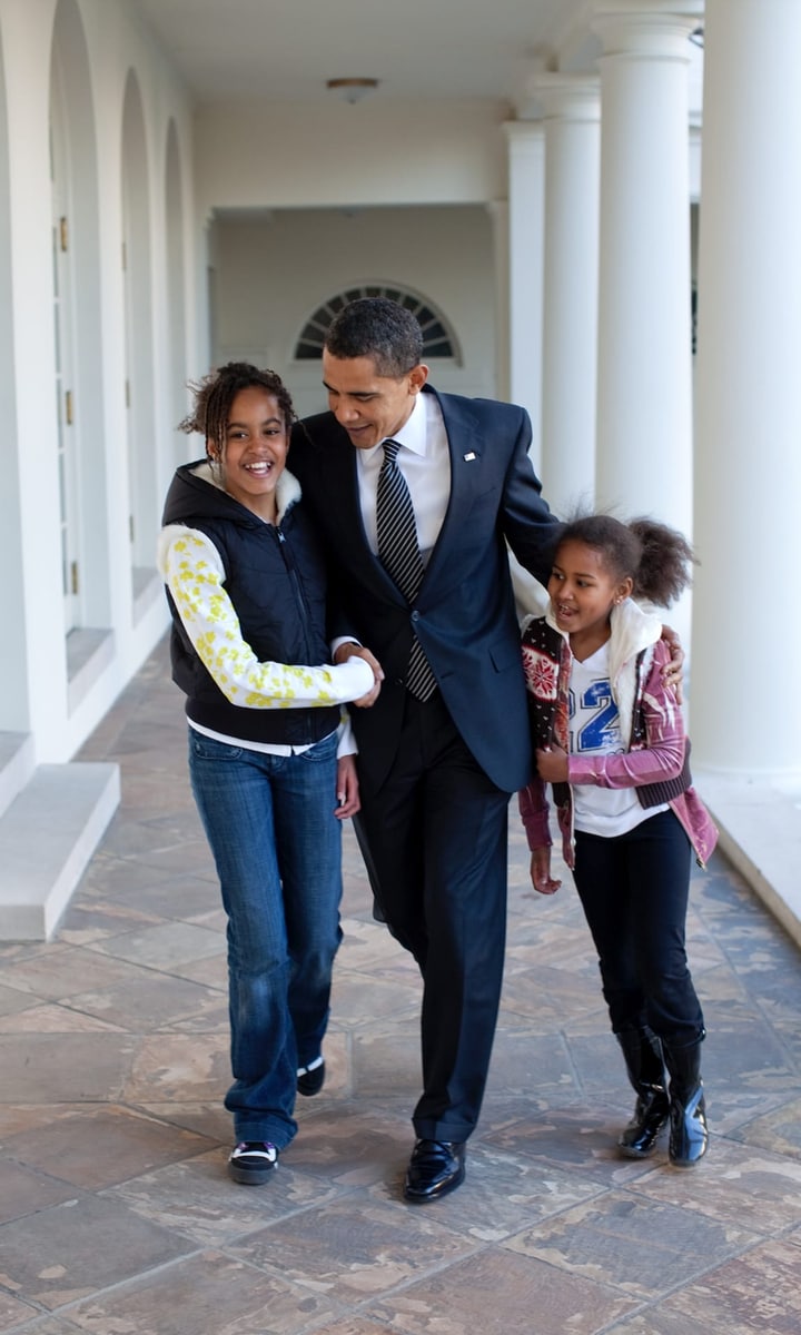 President Barack Obama with daughters Sasha and Malia at the White House.