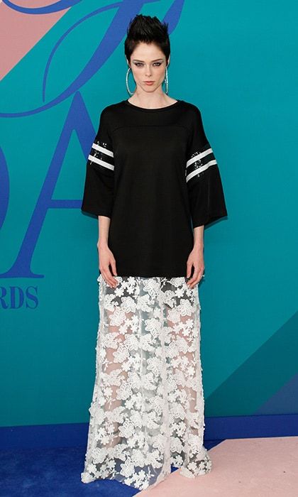 Coco Rocha went for sports luxe in a stripe-sleeved top and lace floor length skirt.
Photo: Getty Images