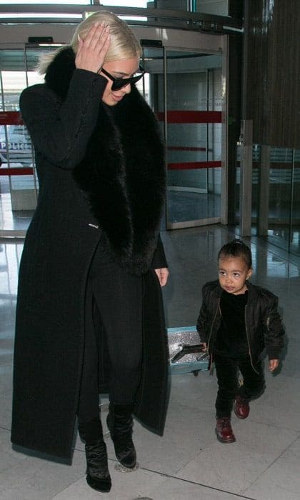 <b>March 2015</b>
<br>
North is basically mini-Kanye in this adorable look. While she looks tough in the bomber jacket and Doc Martens, we love that she's towing a <i>Frozen</i> backpack.
</br><br>
Photo: Getty Images