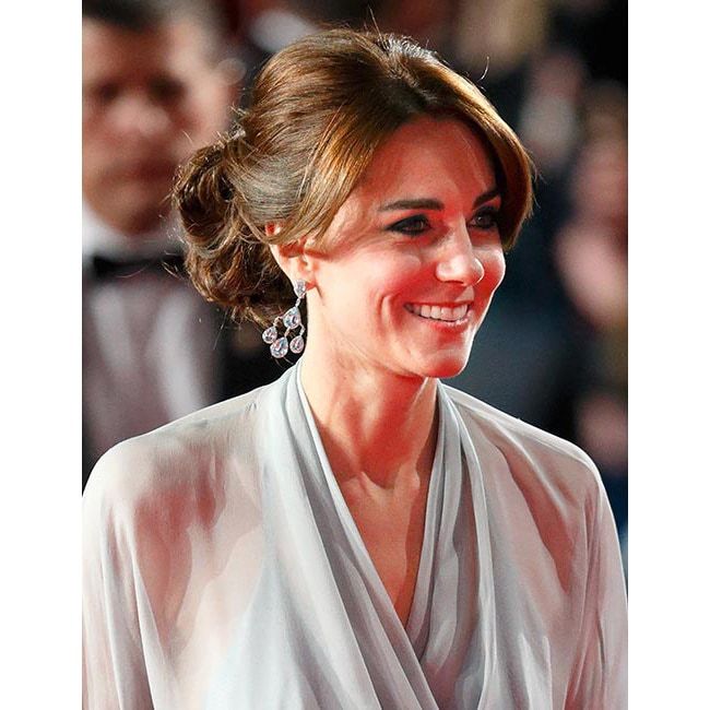 Kate was simply dazzling as she joined Prince William and Prince Harry for the premiere of the new James Bond film 'Spectre' in October. For the event, the elegant royal chose to wear her hair swept up into a chignon, pairing the style with striking dark smoky eye make-up for ultimate red carpet glamour.
<br>Photo: Getty Images