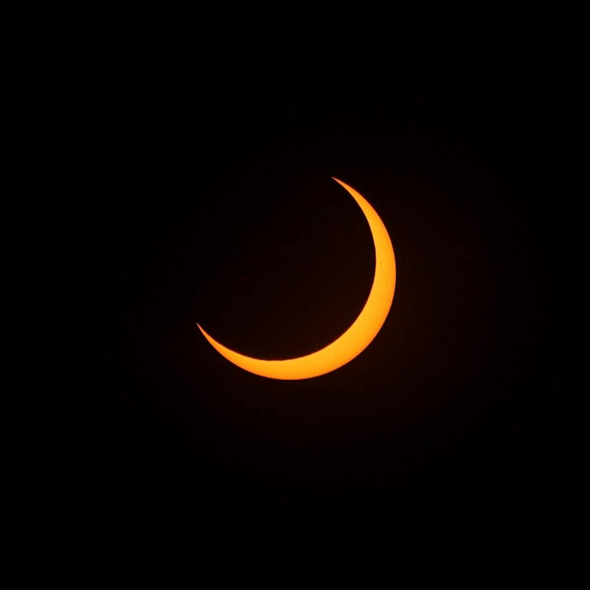 A partial solar eclipse is seen in San Salvador