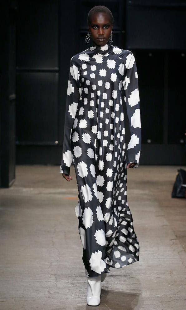 Model with a black and white column dress by Marni