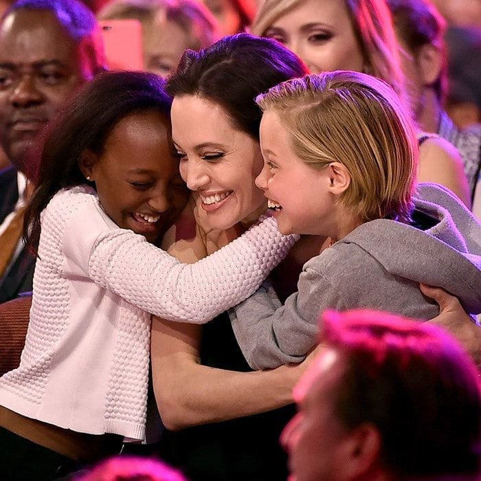 When Angelina won the award for "Favorite Villain" in <I>Maleficent</I> during Nickelodeon's 2015 Kids' Choice Awards in LA, she got a very special prize a hug from daughters Zahara and Shiloh.
Photo: Kevin Winter/Getty Images