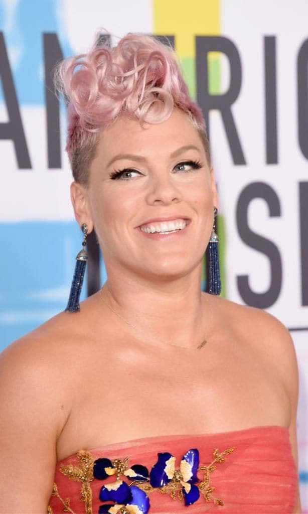 Pink rocking a pink pixie cut