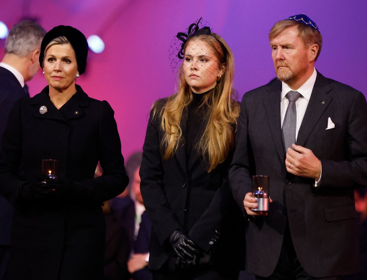 (LtoR) Queen Maxima of the Netherlands, Princess Catharina-Amalia of the Netherlands, Princess of Orange and King Willem-Alexander of the Netherlands place votive candles in front of the train car, the symbol of the event, to pay tribute to the victims during commemorations on the 80th anniversary of the liberation of the German Nazi concentration and extermination camp Auschwitz-Birkenau by the Red Army, in Oswiecim, Poland on January 27, 2025. (Photo by Wojtek RADWANSKI / AFP) (Photo by WOJTEK RADWANSKI/AFP via Getty Images)