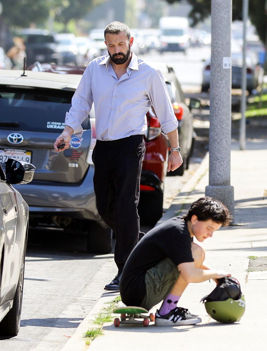 
Ben Affleck was feeling the Southern California heat as he picked up his son, Fin, in Santa Monica. The actor, known for his keen fashion sense, was seen sweating through his stylish button-down shirt as he went about his daddy duties. Despite the warm weather, Affleck remained focused on the task at hand â though, hopefully, he had a clean shirt on hand!