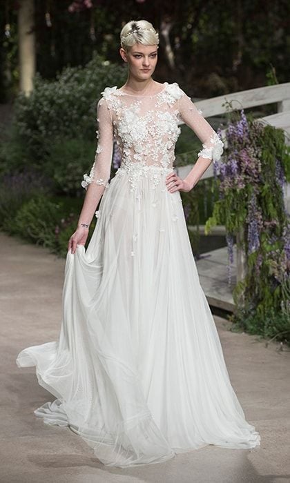 Sheer elegance from Pronovias came in the form of this chiffon number with pleated skirt and applique flowers on the illusion bodice and transparent sleeves.
Photo: Getty Images