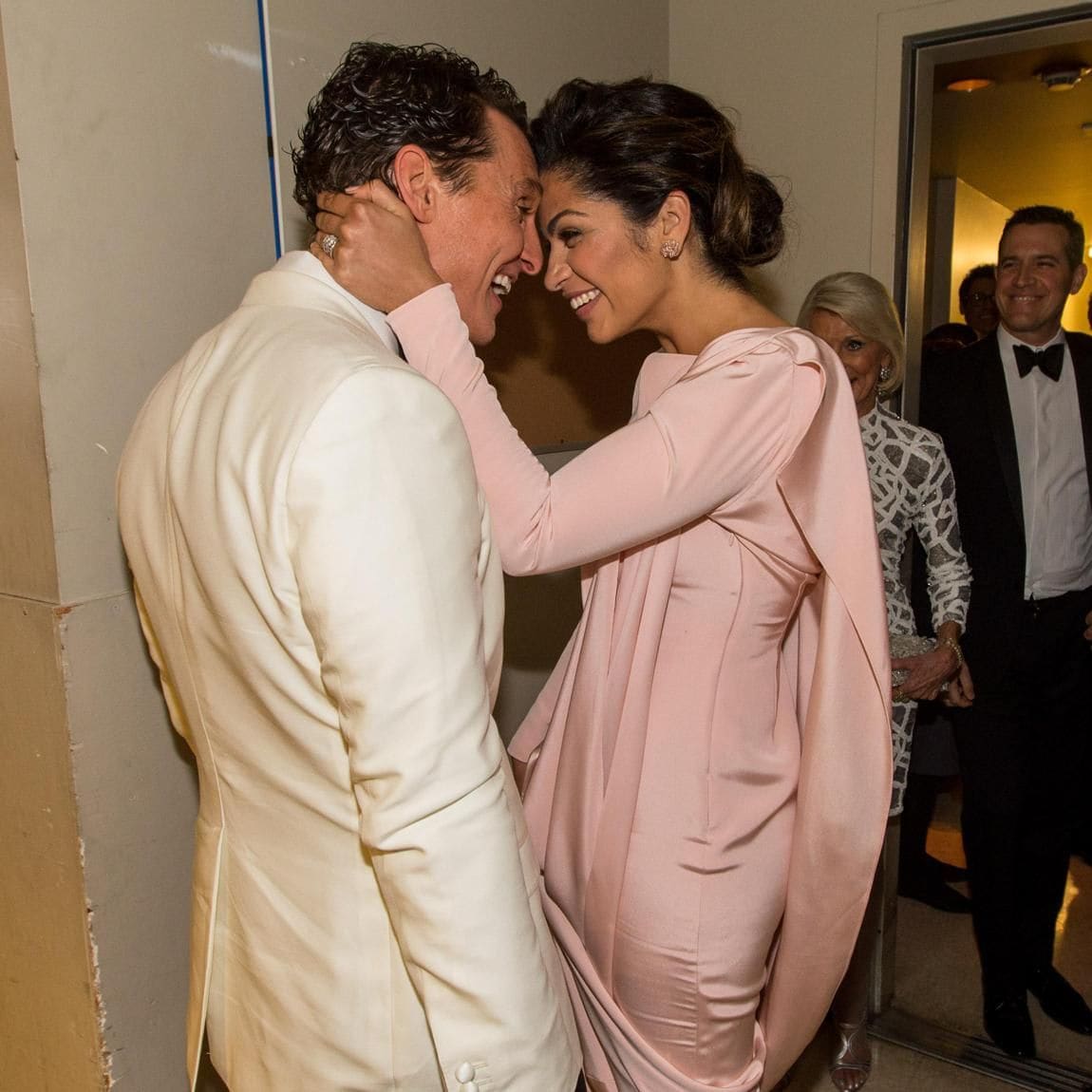 Matthew McConaughey and Camila Alves kiss backstage during the Oscars held at Dolby Theatre