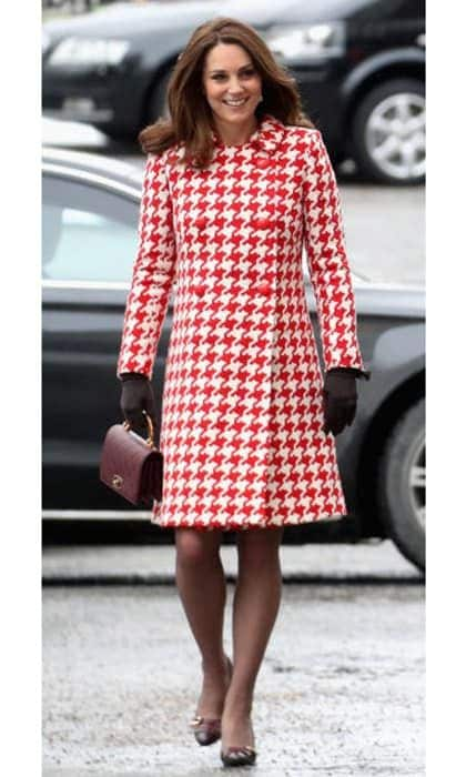 The Duchess packed plenty of Catherine Walker looks in her royal tour wardrobe! While in Stockholm, Kate also donned a red and white houndstooth coat by the fashion house.
Photo: Getty Images