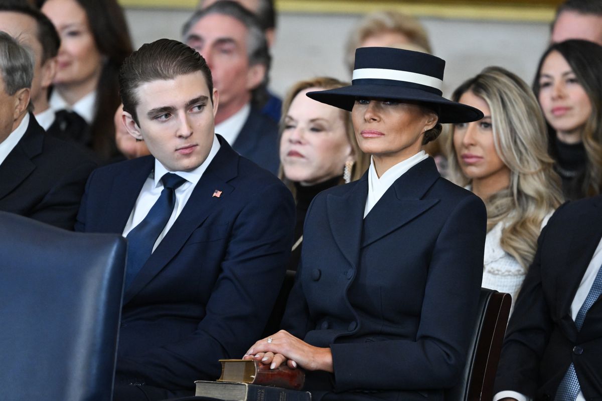 Barron Trump and first lady Melania Trump listen as President Donald Trump gives his inaugural address 