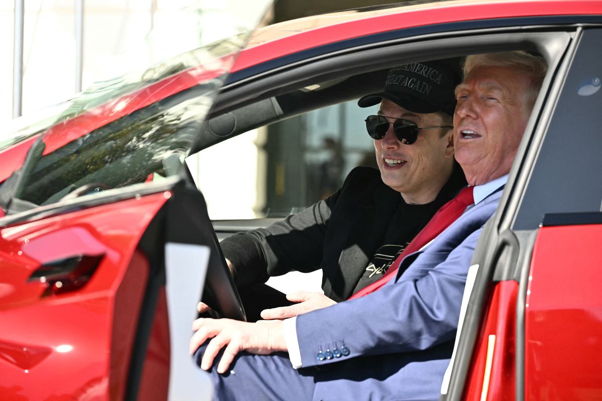 US President Donald Trump and Tesla CEO Elon Musk speak to the press as they sit in a Tesla vehicle on the South Portico of the White House on March 11, 2025 in Washington, DC. (Photo by Mandel NGAN / AFP) (Photo by MANDEL NGAN/AFP via Getty Images)          