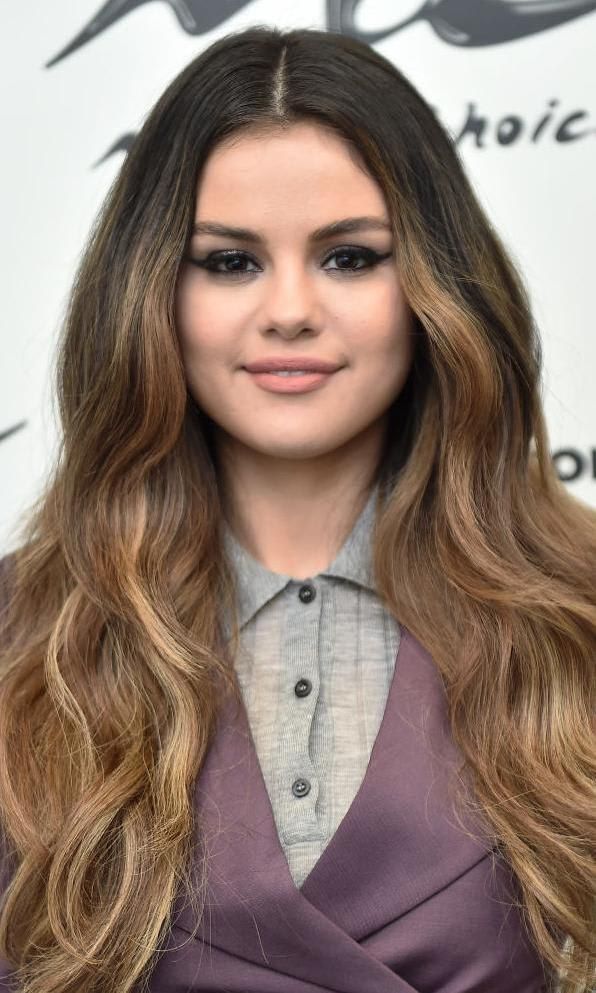 Selena Gomez with smokey eye makeup and nude lips