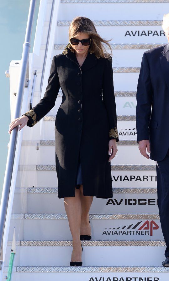 The First Lady stepped off Air Force One in a demure black single-breasted coat with gold sleeve and collar embroidery upon her arrival with her husband at Rome's Fiumicino Airport on May 23, 2017.
Photo: FILIPPO MONTEFORTE/AFP/Getty Images