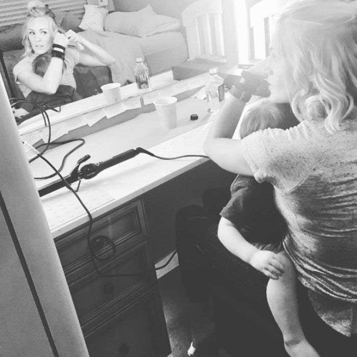 The fact that she had to get ready for a show couldn't stop Carrie Underwood from cuddling with her son. The country star shared a photo of herself doing her hair as Isaiah sweetly rested on her lap. Attached to pic, Carrie wrote, "He doesn't care that Mommy had to get ready for a show... all he knows is that he woke up cranky from his nap and needed a cuddle... and I was more than happy to comply. #multitasking #momlife #roadlife #thestorytellertour."
Photo: Instagram/@carrieunderwood