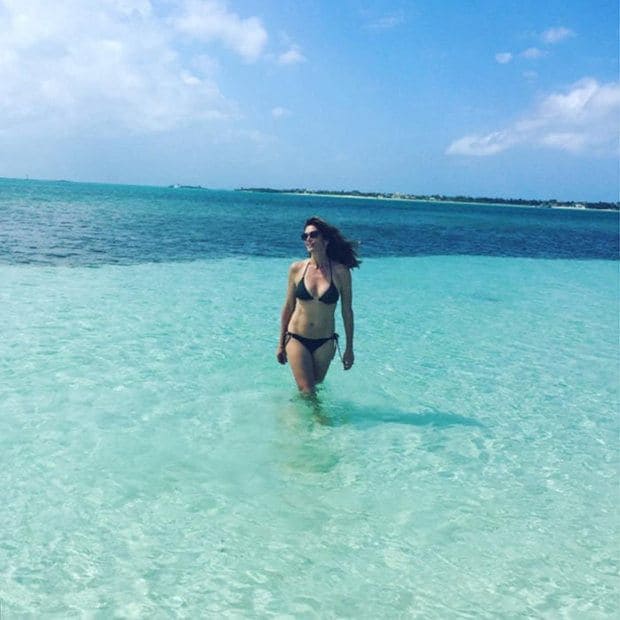 Postcards from paradise! Cindy looks like she is enjoying her vacation, as she wades through a "blue lagoon."
<br>Photo: Instagram/@randegerber