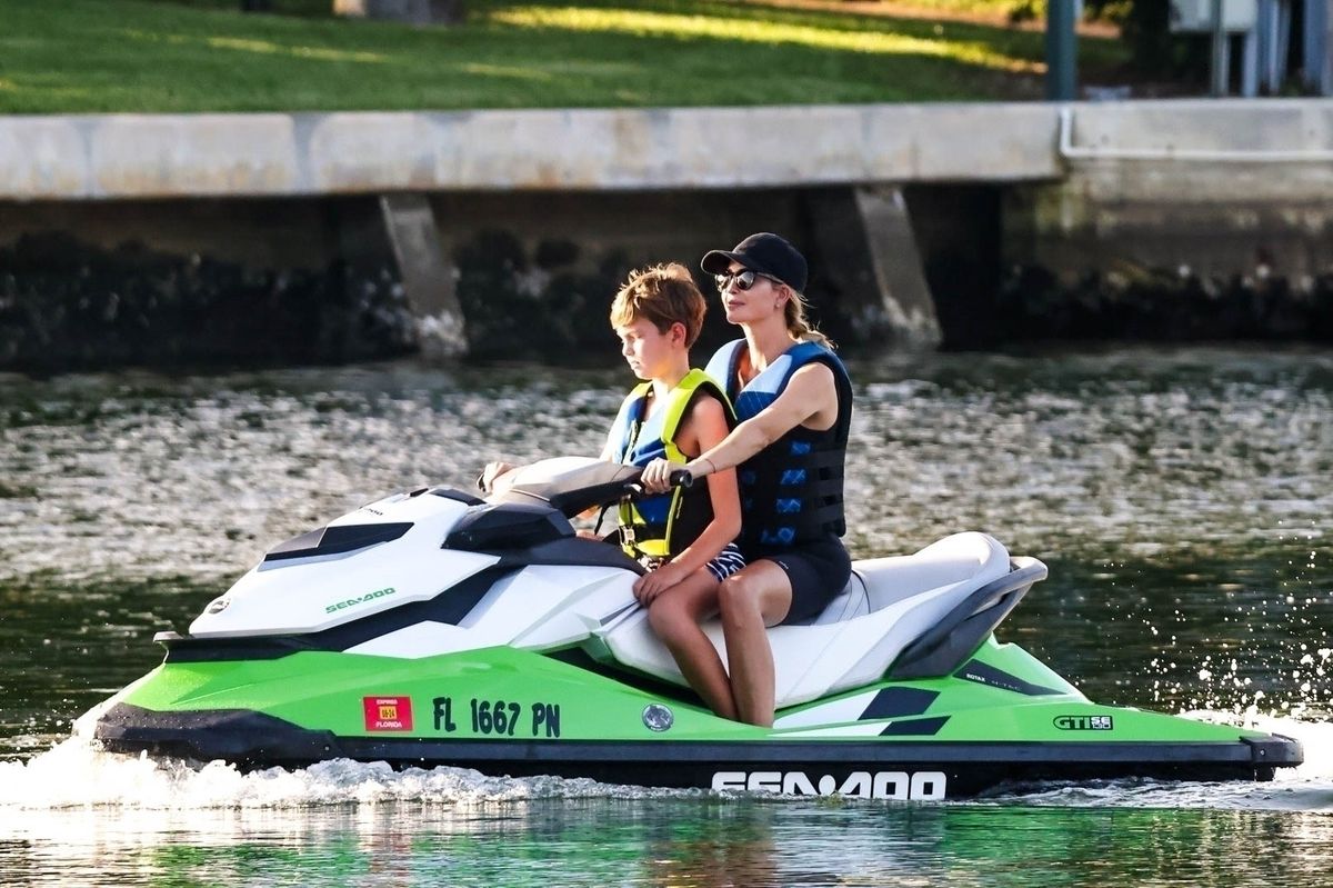 Ivanka Trump takes her son for a fun jet ski ride in Miami, joined by husband Jared Kushner and their children on another watercraft. 