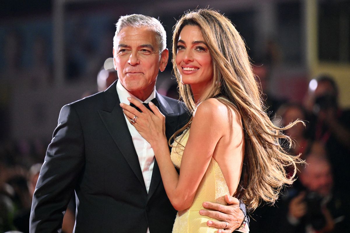 George Clooney and his wife Amal Clooney attend the red carpet of the movie "Wolfs" at the 81st International Venice Film Festival on September 1, 2024. 