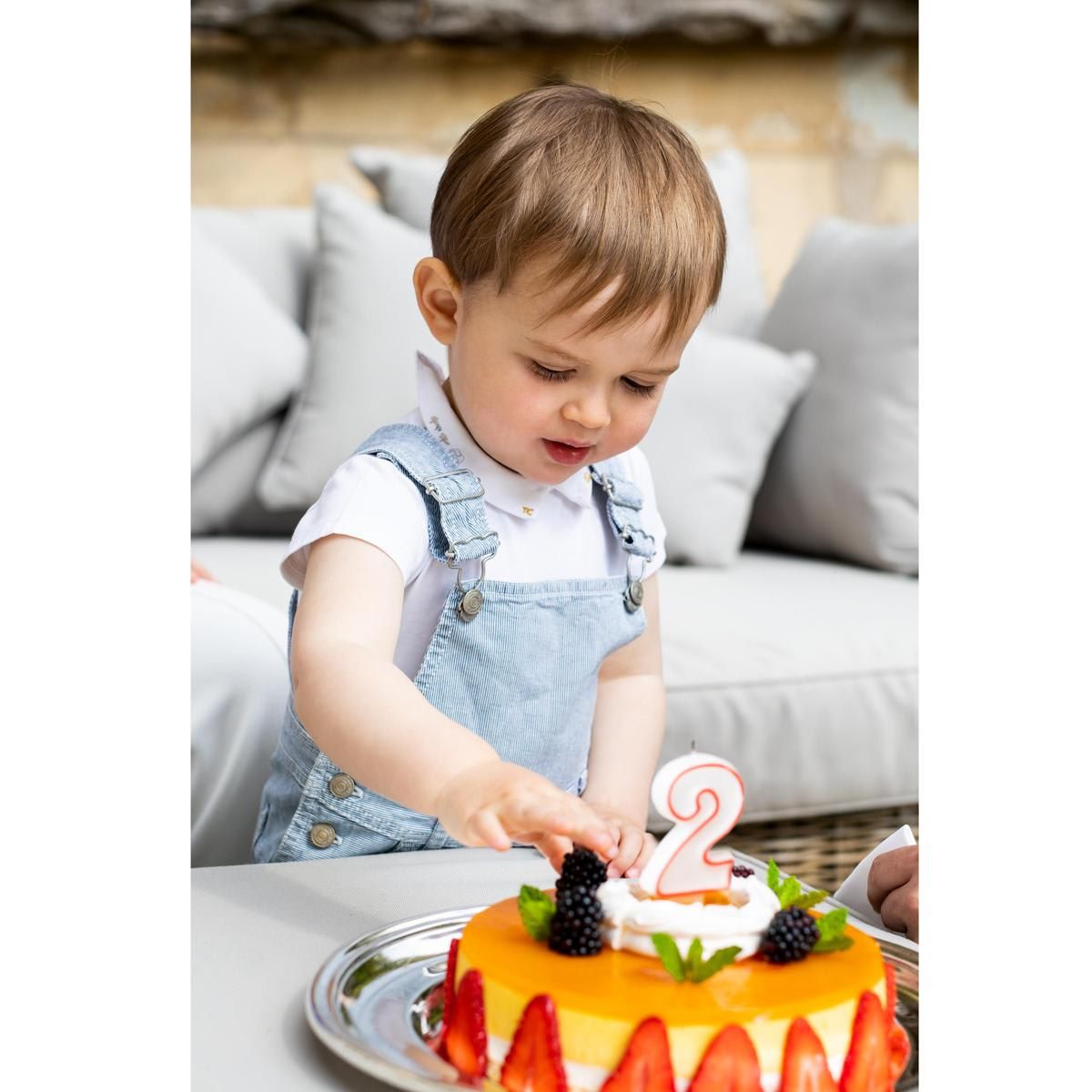 It seems the little Prince couldn't resist tasting his birthday cake!