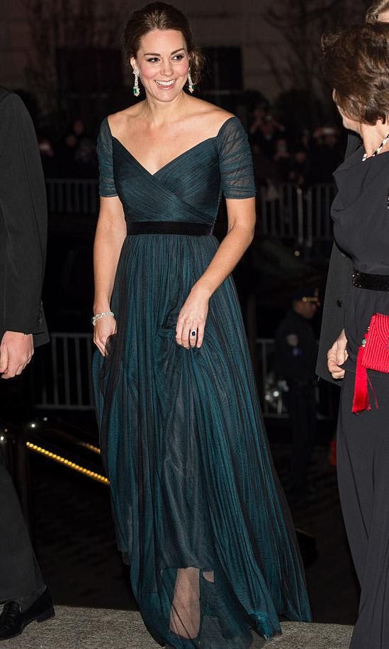 Kate Middleton in a dark green dress with a crossed body and black velvet belt