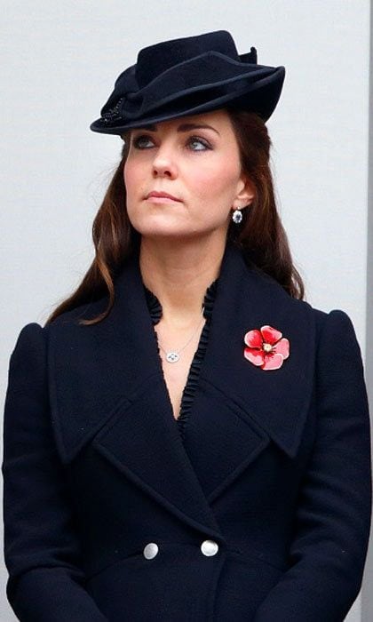 Kate has proved herself to be a queen in her own right, at least in the fashion world. The Duchess wears a navy coat and matching cocktail hat here.
<br>
Photo: Getty Images