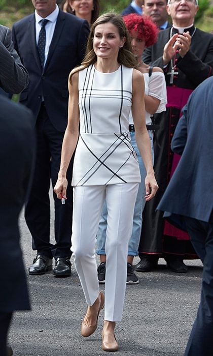 Queen Letizia went for one of her fave labels, BOSS, for this windowpane check tunic top, which she teamed with white trousers and nude flats.
Photo: Getty Images