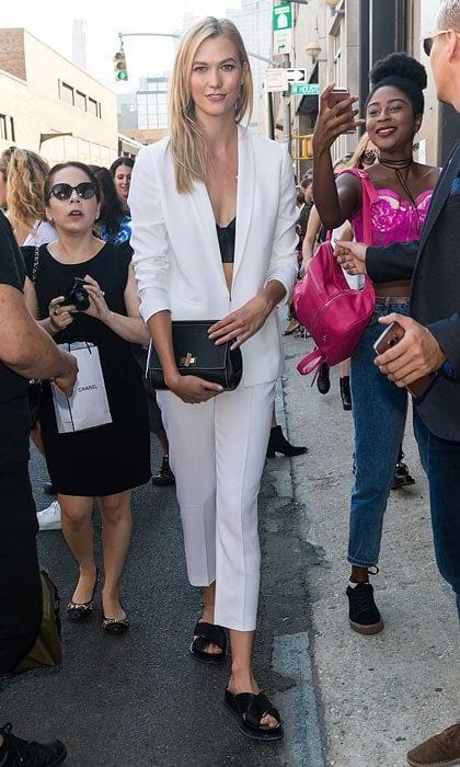 Karlie Kloss opted for a white blazer and matching trousers (sorry, Labor Day 'rule') paired with a black bralette for the Boss Womenswear fashion show.
Photo: Gilbert Carrasquillo/GC Images