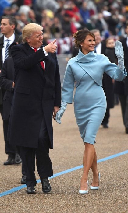 For her debut as the nation's first lady, Melania channeled former first lady Jackie Kennedy. Barron Trump's mother's Inauguration Day outfit was a hint of the simple and chic silhouettes to come: a Ralph Lauren doubleface jacket that featured a collar cutaway and matching mock-turtle dress.
Photo: JIM WATSON/AFP/Getty Images<br><br>For more on Melania Trump's style follow us on <a href="https://www.pinterest.com/hellomagus/melania-trump/">Pinterest</a>