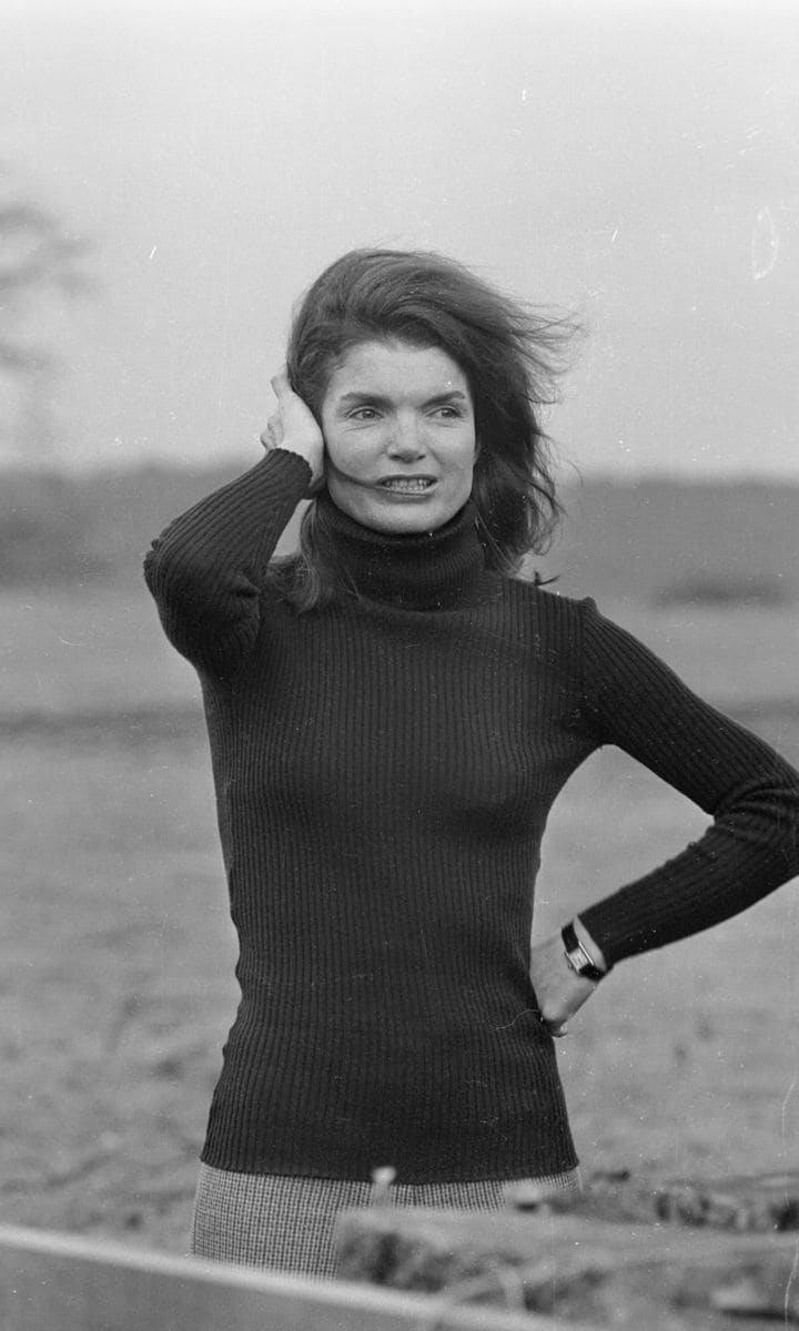 With her windswept hair, the style icon made a simple black turtleneck look glamorous.