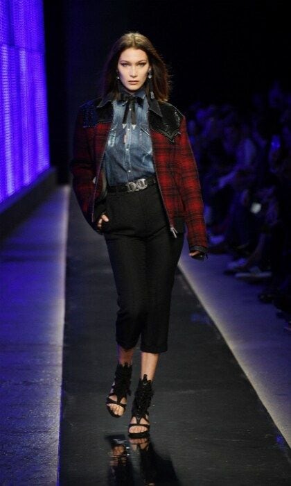 Joining the many stars that participated in Milan Men's Fashion week was Bella Hadid! The pro model walked the runway at the Dsquared2 Fall/Winter 2018/19 show on January 14 in Milan, Italy. She looked gorgeous in a Western-style getup, which featured a plaid cowgirl looking jacket and chambray shirt.
Photo: Venturelli/WireImage