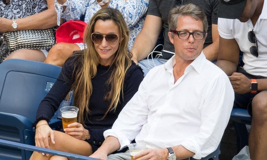 Hugh Grant and Anna Eberstein were spotted taking in a match on Day 7.
Photo: Getty Images