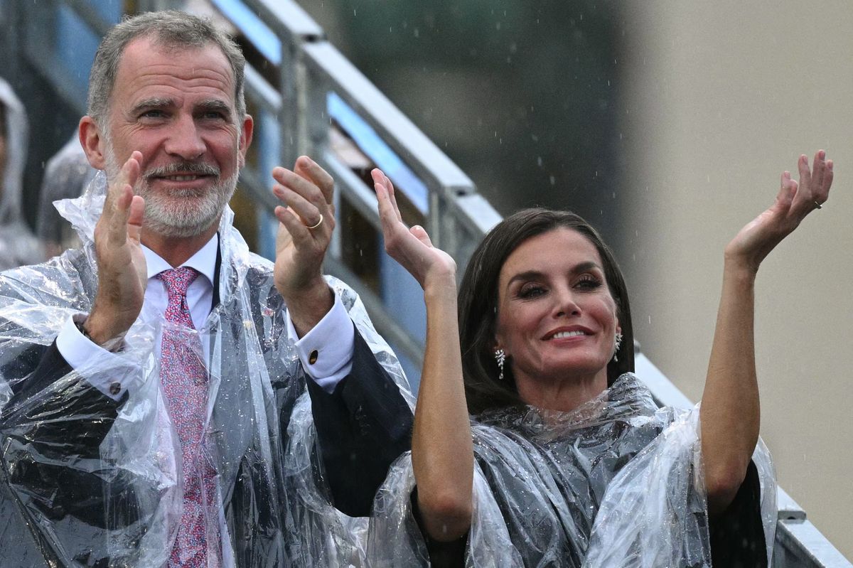 King of Spain Felipe VI (L) and Queen of Spain Letizia (R) applaud the announcement of the Spanish athletes during the opening ceremony of the Paris 2024 Olympic Games in Paris on July 26, 2024. (Photo by Oli SCARFF / AFP) (Photo by OLI SCARFF/AFP via Getty Images)