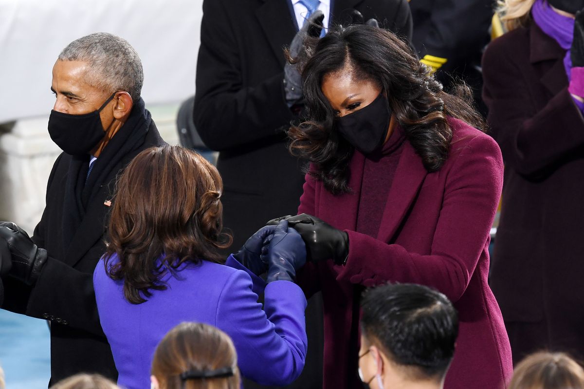 Vice President-elect Kamala Harris (L) is greeted by former first lady Michelle Obama (R) during the 59th Presidential Inauguration at the US Capitol in Washington, January 20, 2021. 