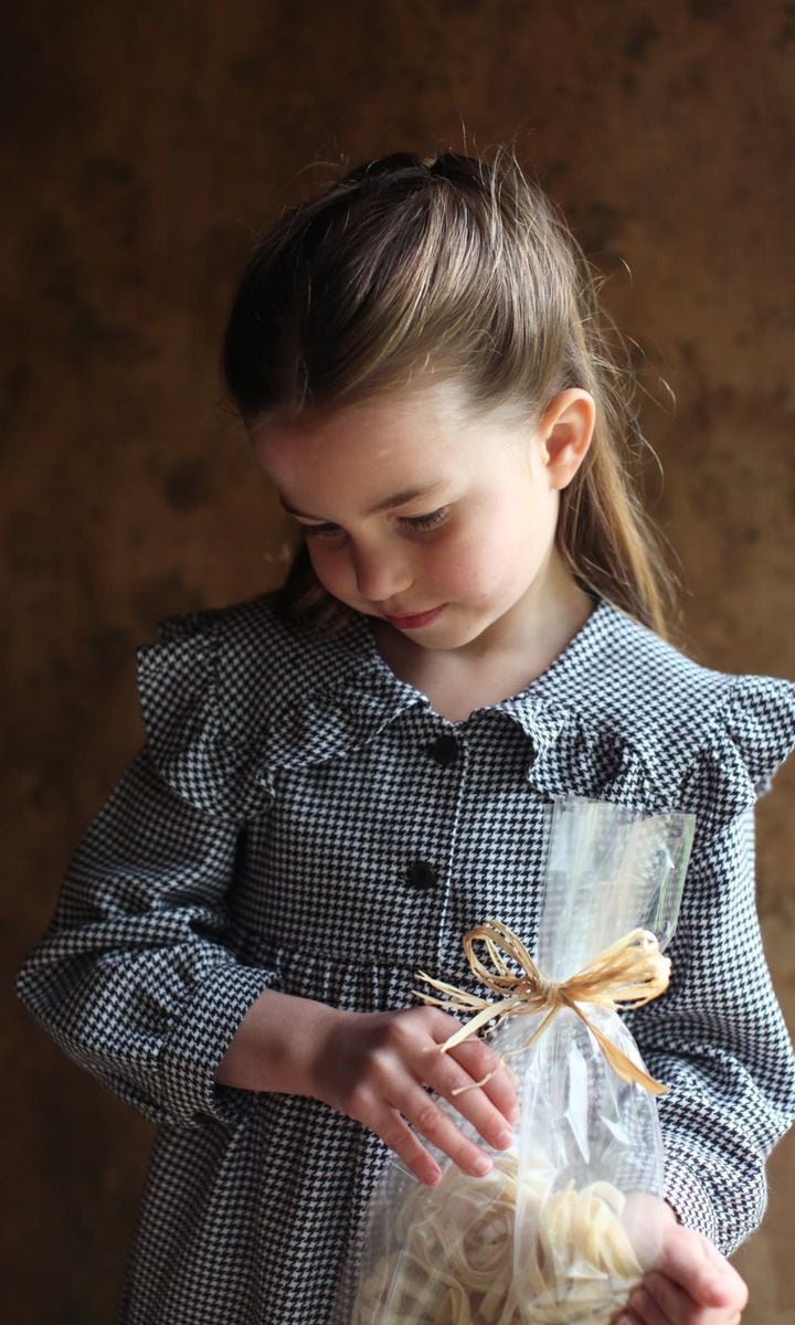 Princess Charlotte is the spitting image of dad Prince William in these side-by-side photos