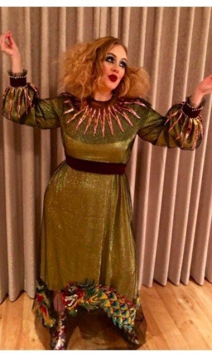 Rolling in the glam! Adele delighted fans when she took to Instagram for the first time in a while to share her early Halloween look. The 29-year-old Grammy-winner got all dolled up as a glamorous clown. She wore a long-sleeve glittering green dress with gold embellishments around the collar and sleeves, a colorful Chinese dragon trim and colorful star-patterned boots. The unique costume was made more obvious by her teased out hair and larger-than-life show makeup. "Happy Early Halloween & Happy Birthday Gorgeous," she wrote on social media along with the picture.
Photo: Instagram/@adele