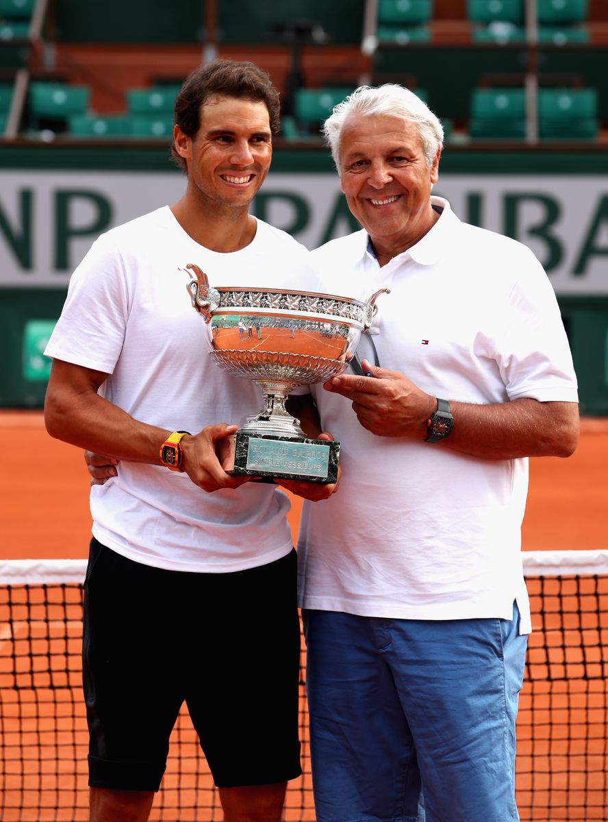 Rafael Nadal of Spain and his father Sebastian Nadal hold the winner's trophy after the men's singles final match between Stan Wawrinka of Switzerland and Rafael Nadal of Spain on day 15 of the 2017 French Open at Roland Garros on June 11, 2017 in Paris. France. (Photo by Clive Brunskill/Getty Images)