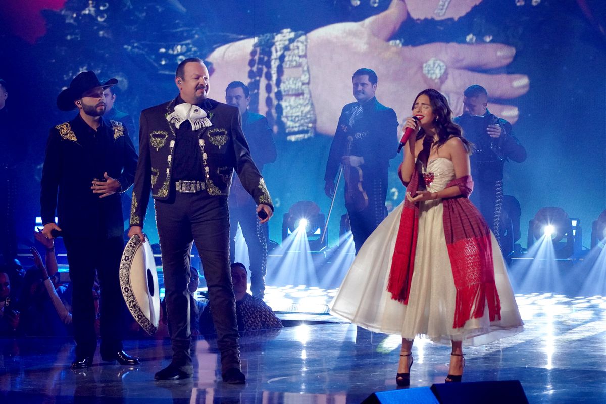 Angela Aguilar wore a bold white and red look as she performed alongside Leonardo and Pepe Aguilar 