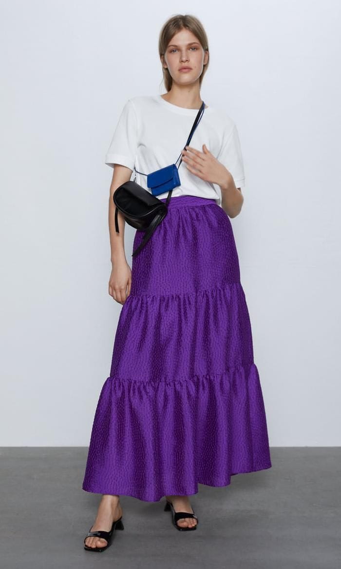 Full photo of model wearing purple layered maxi skirt