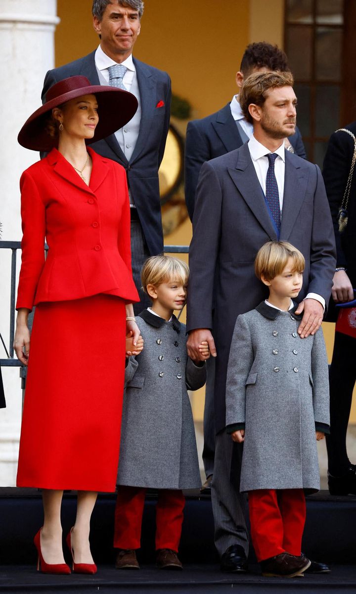 Beatrice Borromeo looked incredibly chic wearing a red skirt suit and wide-brimmed hat. Stefano and Francesco complemented their mother wearing matching red trousers.