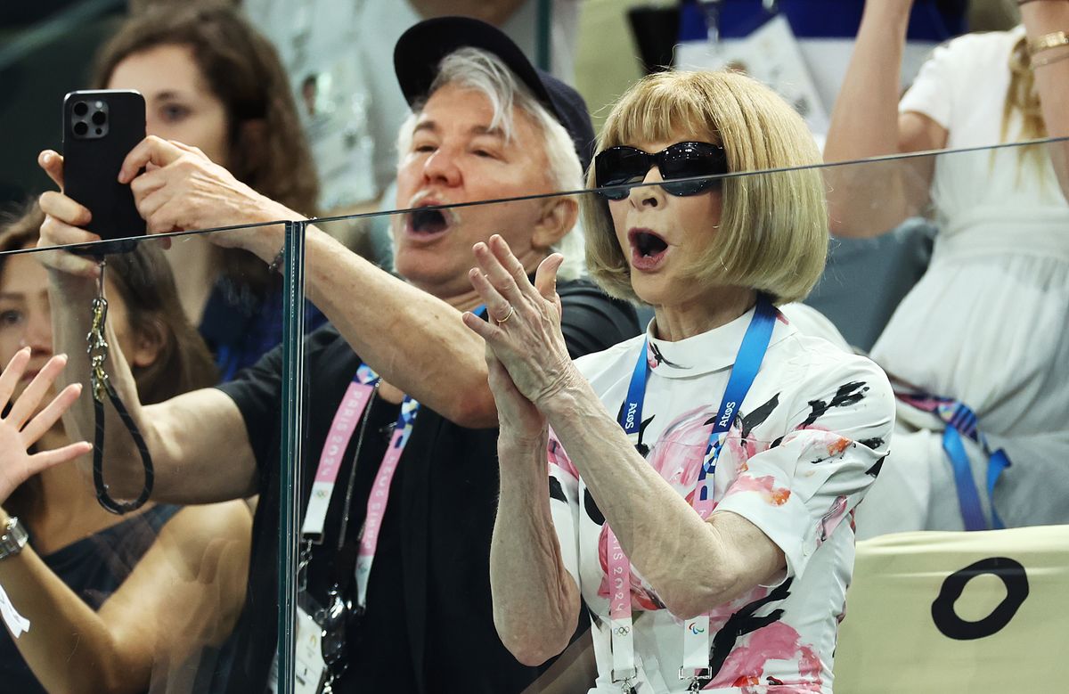  Anna Wintour and Baz Luhrmann attend the Artistic Gymnastics Women's Qualification on day two of the Olympic Games Paris 2024 at Bercy Arena on July 28, 2024, in Paris, France. (Photo by Arturo Holmes/Getty Images)