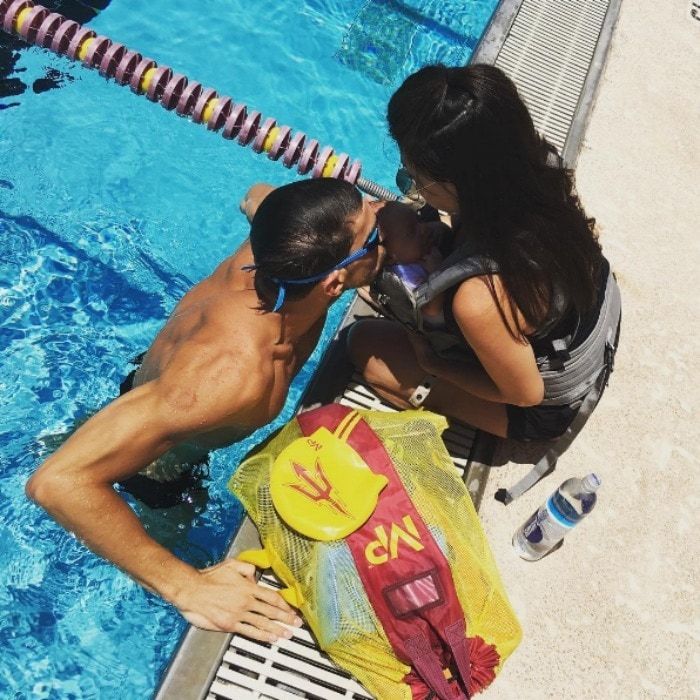 Poolside kisses. Boomer paid a visit (with his mom Nicole) to Michael's "work."
<br>
Photo: Instagram/@icole.m.johnson