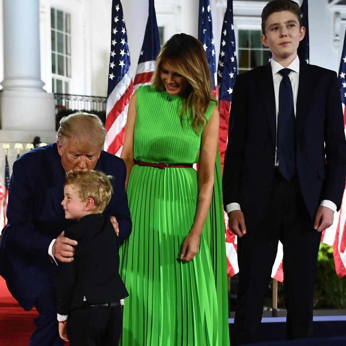 The first lady stunned in a neon green pleated dress on Aug. 27