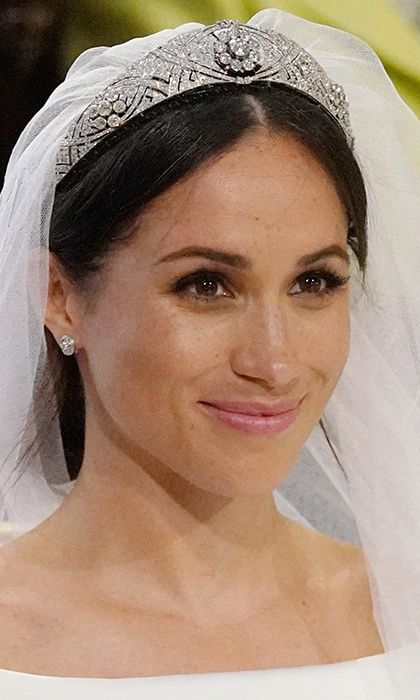 The royal bride topped her beautiful couture ensemble with a fittingly one-of-a-kind piece - the Queen Mary Diamond Bandeau Tiara. The heirloom diamond and platinum tiara, which Meghan borrowed from the Queen, was made in 1932 and is centred by an 18th century ten-diamond brooch.
Photo: Getty Images