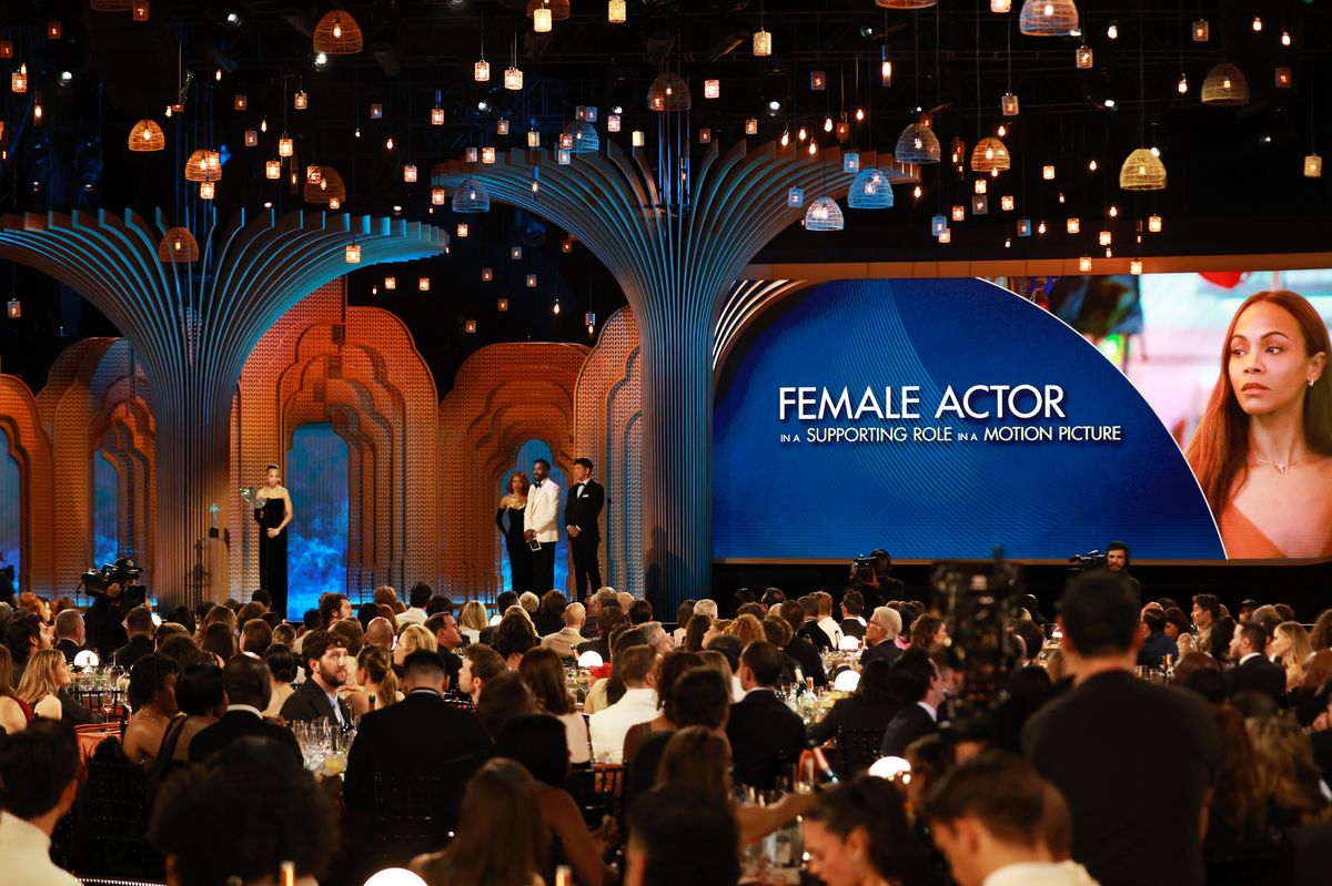 Zoe Saldaña accepts the Outstanding Performance by a Female Actor in a Supporting Role award for "Emilia Perez" from Keke Palmer and Colman Domingo