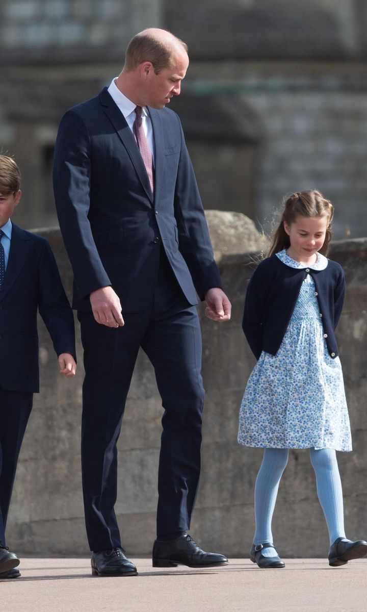 Princess Charlotte, wearing a floral print dress and cardigan, adorably walked beside her father.