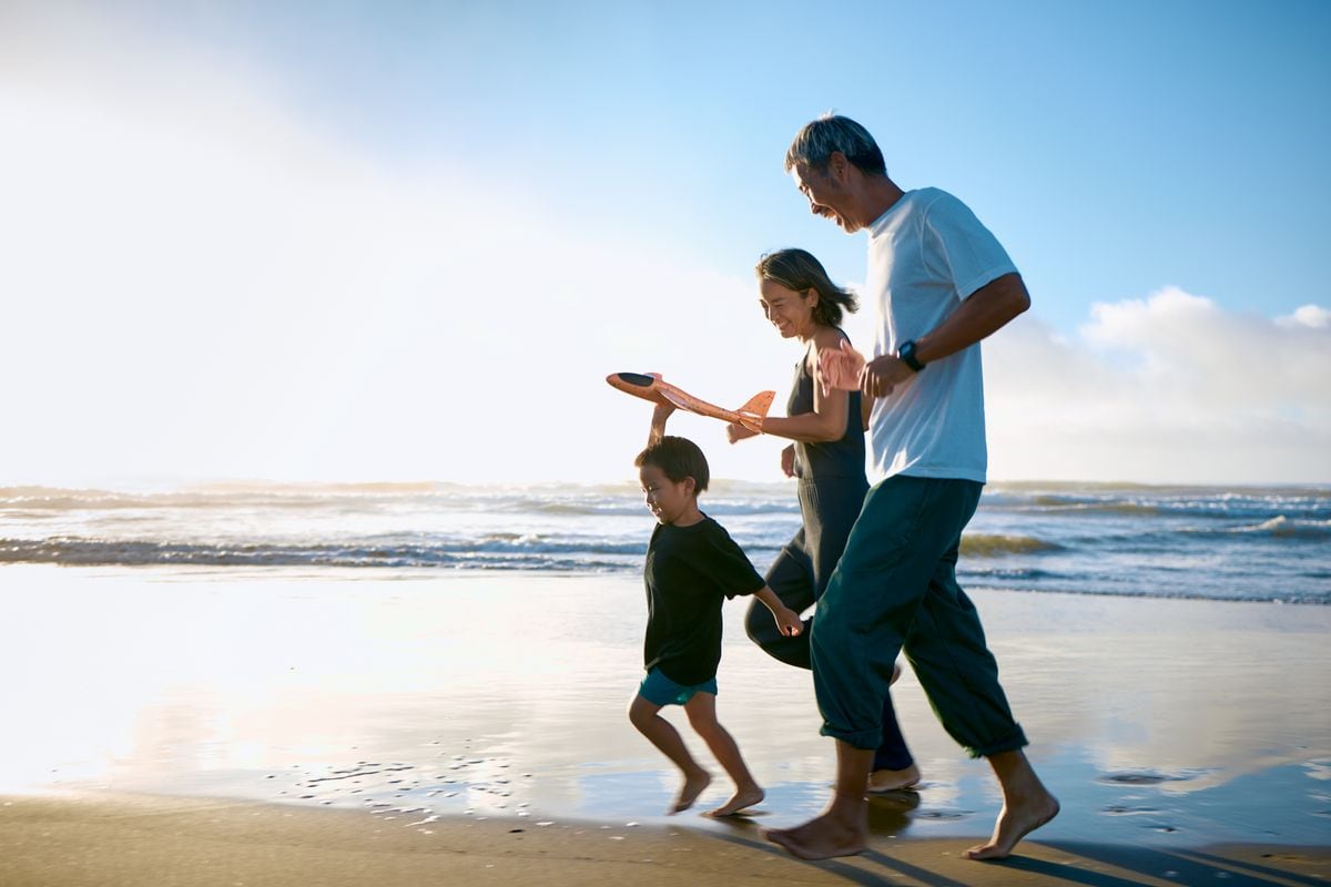 Family run in the morning surf.