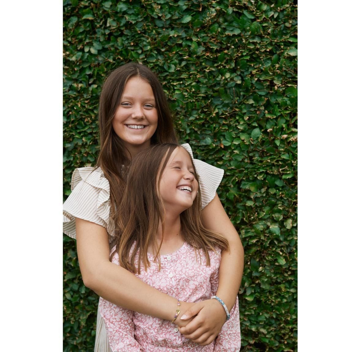 Josephine and Isabella looked stylish wearing summer frocks. Mary's oldest daughter, 13, donned a MUNTHE ruffled striped voile midi dress for the photo session, while her nine-year-old sister sported a pink printed design.