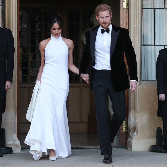 On May 19, Meghan dazzled as she stepped out for her wedding reception holding hands with her very dashing husband Prince Harry. The radiant bride wore a white halterneck silk crepe gown designed by Stella McCartney and silk satin Aquazurra shoes featuring nude mesh and baby blue soles.
Photo: Getty Images