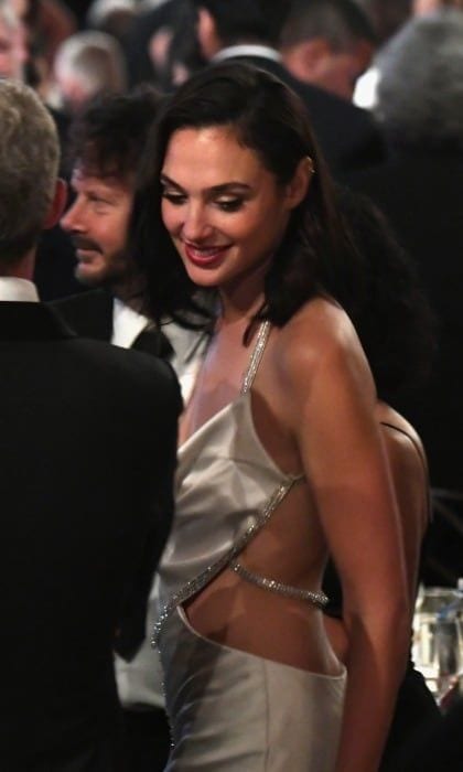 Although Gal Gadot skipped out on the Governors Awards red carpet, the Israeli actress was spotted looking radiant inside the Ray Dolby Ballroom at Hollywood and Highland Center. The <i>Wonder Woman</i> star showed off her toned back in a cut-out silver dress with spaghetti straps.
Photo: Kevin Winter/Getty Images