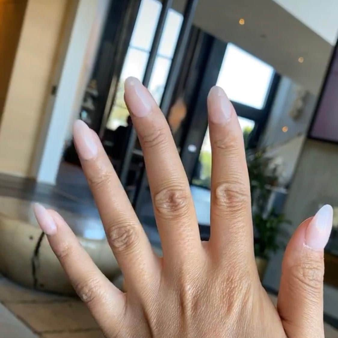 Chrissy Teigen wears press on nails