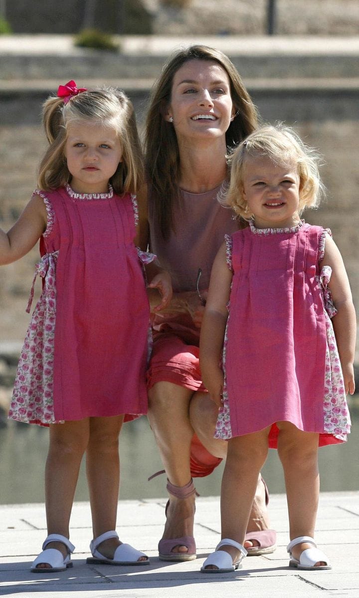 Pink ladies! Letizia coordinated in blush shades with her girls during the royal family's summer holiday in 2009.